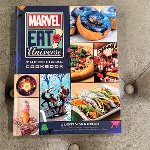 Marvel Eat the Universe Cookbook with Blue and Red Accents